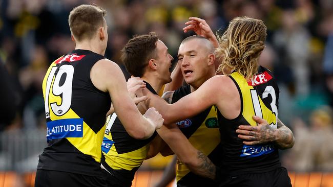 MELBOURNE, AUSTRALIA - JUNE 15: Dustin Martin of the Tigers celebrates a goal with teammates during the 2024 AFL Round 14 match between the Richmond Tigers and the Hawthorn Hawks at The Melbourne Cricket Ground on June 15, 2024 in Melbourne, Australia. (Photo by Michael Willson/AFL Photos via Getty Images)