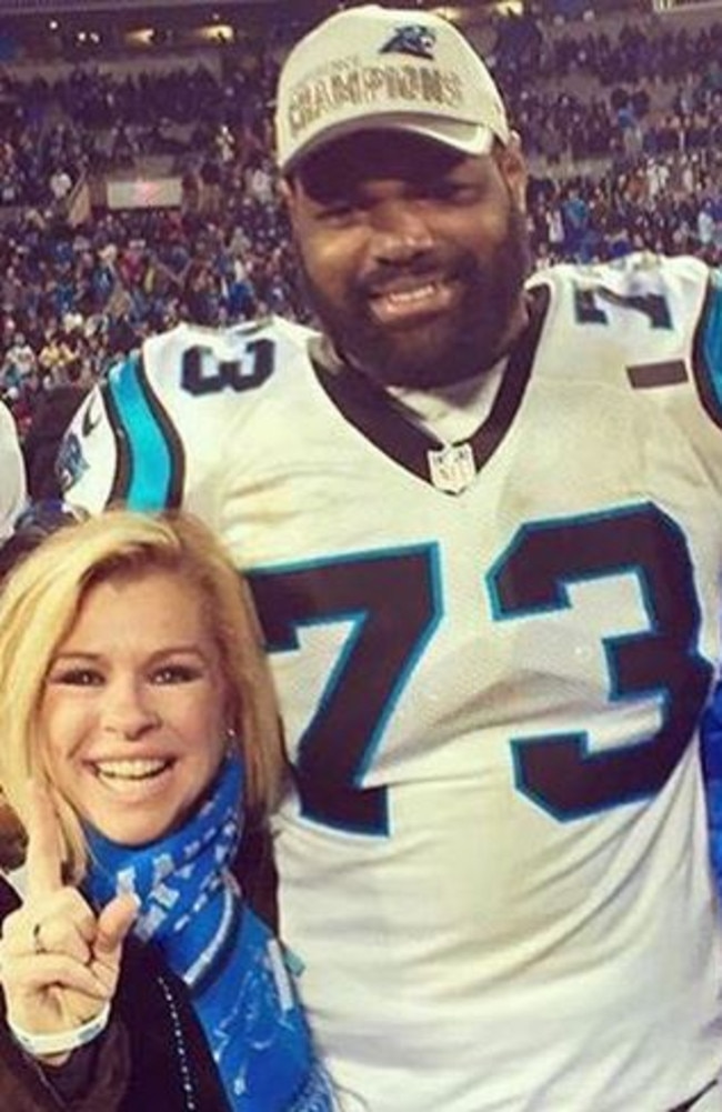 Carolina Panthers player Michael Oher with hist adoptive parents Leigh Anne and Sean Touhy. Oher's life was portrayed in the 2009 Hollywood film, "The Blind Side".