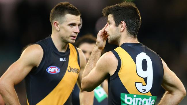 MELBOURNE, AUSTRALIA — APRIL 30: Trent Cotchin, Brett Deledio and Dustin Martin of the Tigers react at full time after losing the round six AFL match between the Richmond Tigers and the Port Adelaide Power at Melbourne Cricket Ground on April 30, 2016 in Melbourne, Australia. (Photo by Scott Barbour/Getty Images)