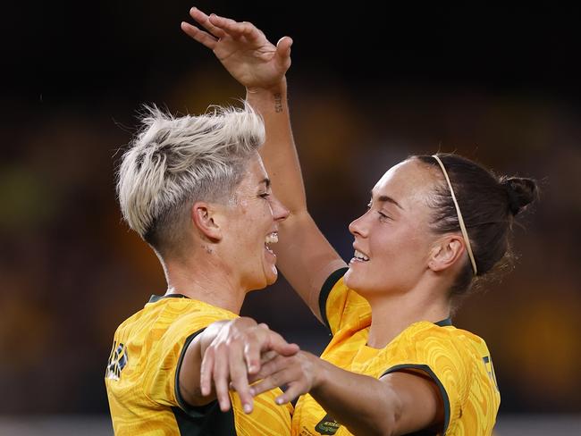 MELBOURNE, AUSTRALIA - FEBRUARY 28: Michelle Heyman of the Matildas celebrates a goal with team mare Caitlin Foord during the AFC Women's Olympic Football Tournament Paris 2024 Asian Qualifier Round 3 match between Australia Matildas and Uzbekistan at Marvel Stadium on February 28, 2024 in Melbourne, Australia. (Photo by Darrian Traynor/Getty Images)