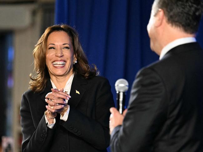 TOPSHOT - US Vice President and Democratic presidential candidate Kamala Harris and US Second Gentleman Douglas Emhoff attend a watch party after a presidential debate with former US President and Republican presidential candidate Donald Trump at the Cherry Street Pier in Philadelphia, Pennsylvania, on September 10, 2024. (Photo by Jim WATSON / AFP)