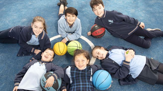 Templestowe Park Primary School won a Leader Local Grant to install lighting at their synthetic sports pitch. Twelve-year-olds at back are Lily, Kris and William, with Thomas (8), Grace (9) and Kara (10) at the front. Picture: Ellen Smith