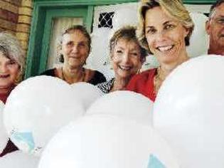 Swell bunch: Heartfelt House executive director Vicki Hamilton (front) gets a helping hand on White Balloon Day yesterday from (rear, from left) board member Julia Adlington, program development co-ordinator Heidi Tornow, group facilitator Mandy Waring, and chairman Larry Rawstorne. Picture: Cathy Adams