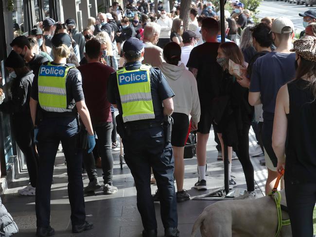 Massive crowds wait outside cafes along Domain Rd. Picture: David Crosling