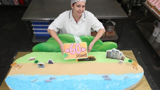 Goldstein's bakery cake decorators making the Gold Coast's 60th birthday cake at their Ashmore factory. Janette Crane works on the creation. Picture Glenn Hampson