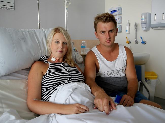 Ashley Buchanan with her husband Caine. Ashley went into labour and had to have an emergency caesarean after eating a dodgy chicken roll at Sylvania's Box Village Bakery. Picture: Tim Hunter