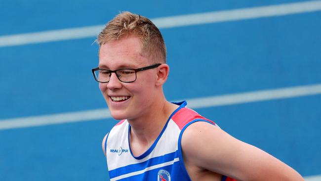 Happy days! Mathew Basanovic of Port Hacking High School after winning his hurdles final.