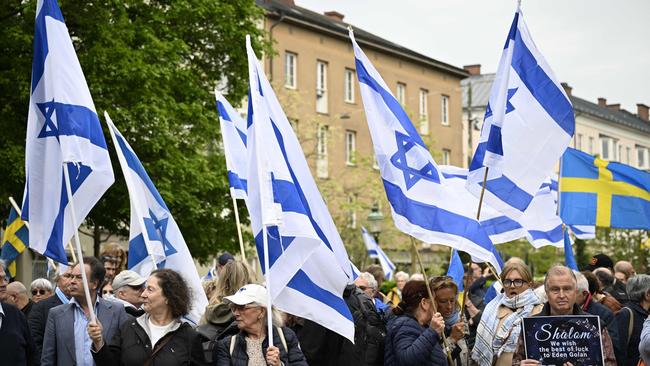 Demonstrators hold Israeli and Swedish flags in support of Russian-Israeli singer Eden Golan representing Israel with the song "Hurricane" at the European Song Contest. Picture: AFP.