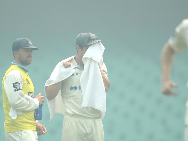 Sean Abbott was wiping smoke as well as sweat out of his eyes.