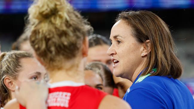 MELBOURNE, AUSTRALIA - SEPTEMBER 06: Tamara Hyett, Senior Coach of the Bulldogs addresses their players during the 2024 AFLW Round 02 match between the Western Bulldogs and the Port Adelaide Power at The Melbourne Cricket Ground on September 06, 2024 in Melbourne, Australia. (Photo by Dylan Burns/AFL Photos via Getty Images)