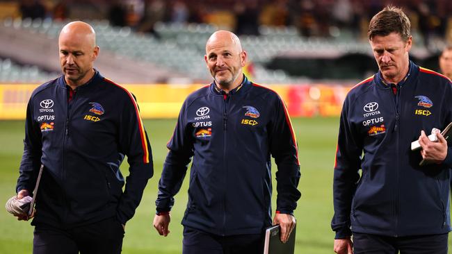 Adelaide coach Matthew Nicks, left, leaves the ground with head of football Adam Kelly and assistant coach Ben Hart following the Crows’ Round 10 loss to Melbourne at Adelaide Oval. Picture: Daniel Kalisz/Getty Images