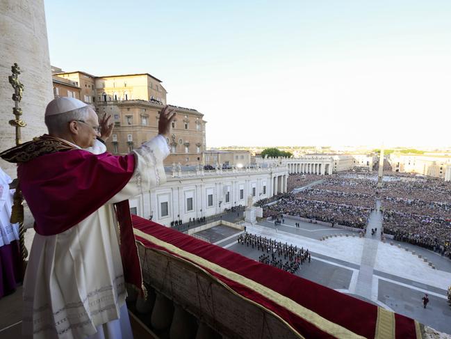 Pope Leo XIV waves to faithful and pilgrims gathered in St Peter's Square shortly after his election on Thursday. Picture: Vatican Media via AP