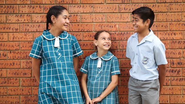 Caitlyn Paulo, Gabriella Leonardi and Lamaze Tyrell celebrated the primary school’s history. Picture: Carmela Roche