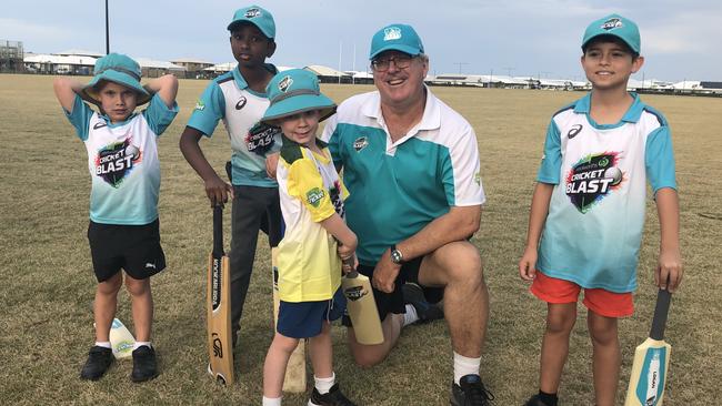 Andrew Middleton with juniors of the new Nirimba Cricket Club.