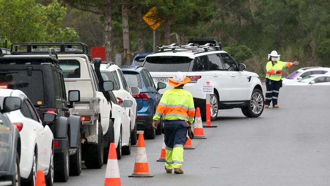 Motorists lining up for COVID-19 tests in Brisbane today. Picture: Jono Searle/Getty Images