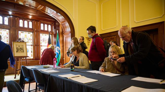 People sign condolence books at Government House, Adelaide, on the death of Queen Elizabeth II. Picture: Matt Loxton