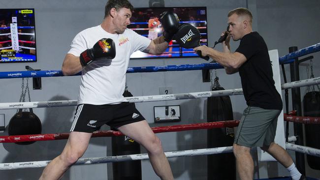 Mooney and Tomlinson work out at Wildfighter gym. Picture: Alan Barber