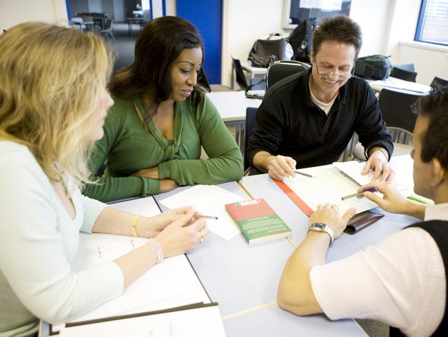 Teacher talking with parents at school.