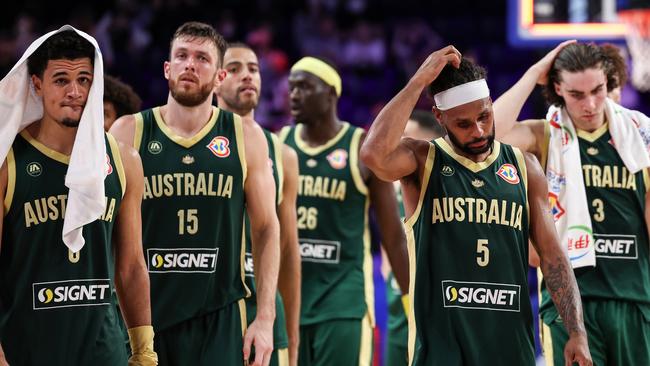 Australian players look dejected after bombing out of the World Cup. Picture: Getty Images