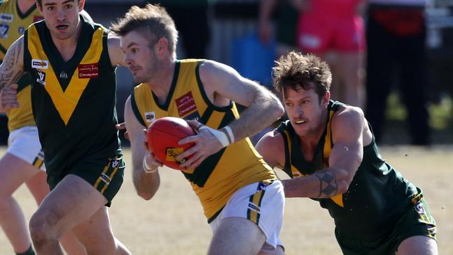 Chris Hormon with the ball for Kinglake. Picture: Stuart Milligan