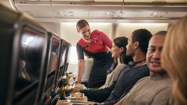 Inflight economy cabin passengers are getting food served in Qantas A330 and also can get a drink refill or two.