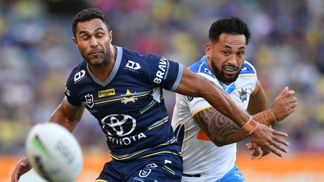 North Queensland Cowboys against Gold Coast Titans at Queensland Country Bank Stadium. Titans' Patrick Herbert (right) puts kick in behind Cowboys Justin O'Neill. Picture: Evan Morgan