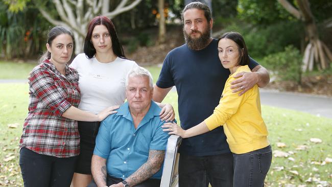 Kelly Wilkinson's family on the Gold Coast in the days after her death sisters Emma Wilkinson (check shirt), Natalie Wilkinson (white top), Danielle Carroll (yellow top) and her husband Rhys Carroll, and Kelly's dad Reg Wilkinson (blue shirt). Picture: Tertius Pickard