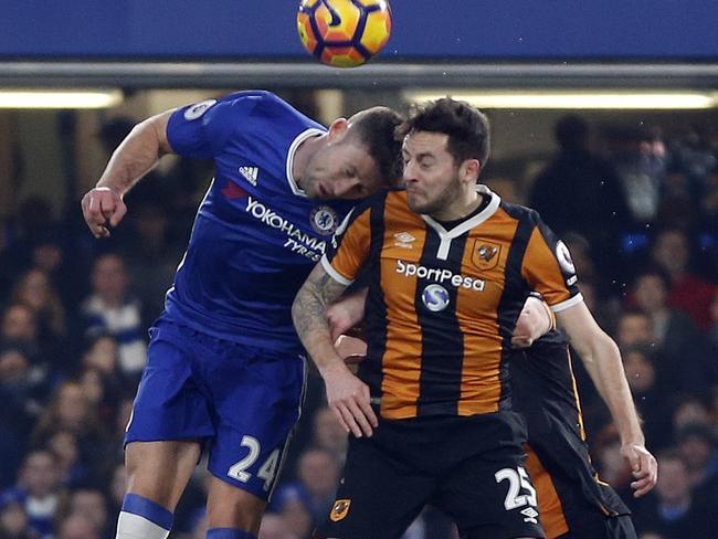 Hull City's Ryan Mason clashes heads with Chelsea's Gary Cahill.