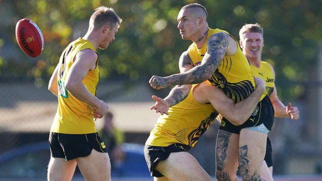 Dustin Martin fires off a handball as Richmond returns to full training.