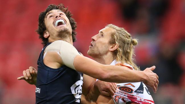 Jack Silvagni and Nick Haynes compete for possession.