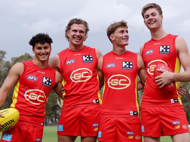 GOLD COAST, AUSTRALIA - NOVEMBER 01: Jake Roger, Jed Walter, Will Graham and Ethan Read pose during a Gold Coast Suns AFL media opportunity at Palm Beach Currumbin Football Club on November 01, 2023 in Gold Coast, Australia. (Photo by Chris Hyde/Getty Images)