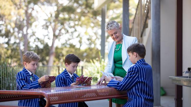 Julie Quinn teaching students Xavier Irwin, Toby Connel and Elijah Hemming at St Joseph’s. Picture: David Kelly