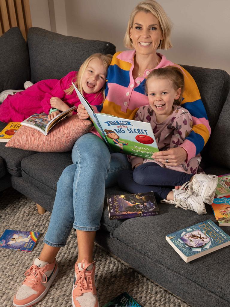 Fox Footy presenter Sarah Jones, pictured with daughters Mila, 7, and Halle, 5, is passionate about spelling and literacy and says AFL players transitioning to second careers benefit from having good communication and literacy skills. Picture: Tony Gough