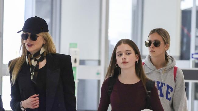 Nicole Kidman and her daughters, Sunday, 15 and Faith, 12, at Sydney Airport. Picture: Media Mode