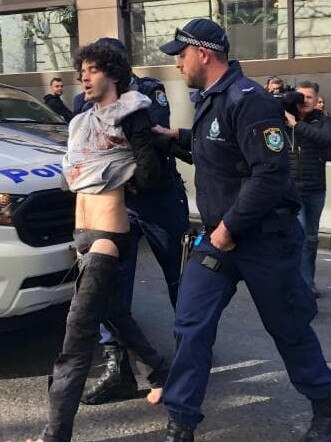 Mert Nay being arrested in the CBD.