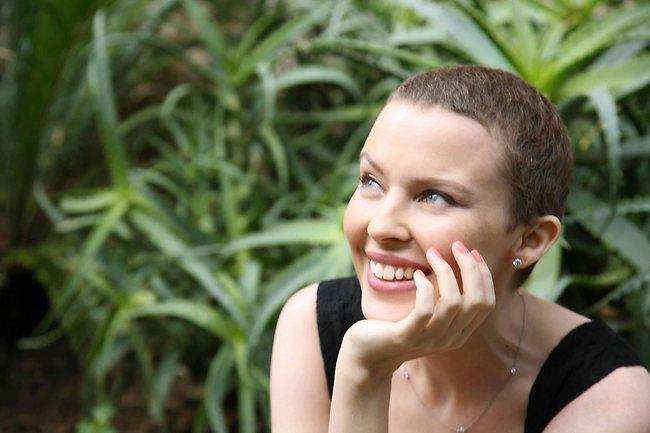 Minogue's hair starts growing back after breast cancer treatment in 2006. Picture: AP