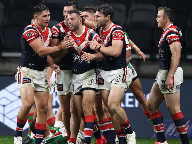 SYDNEY, AUSTRALIA - MAY 29: James Tedesco of the Roosters celebrates with his team mates after scoring a try during the round three NRL match between the Sydney Roosters and the South Sydney Rabbitohs at Bankwest Stadium on May 29, 2020 in Sydney, Australia. (Photo by Mark Kolbe/Getty Images)