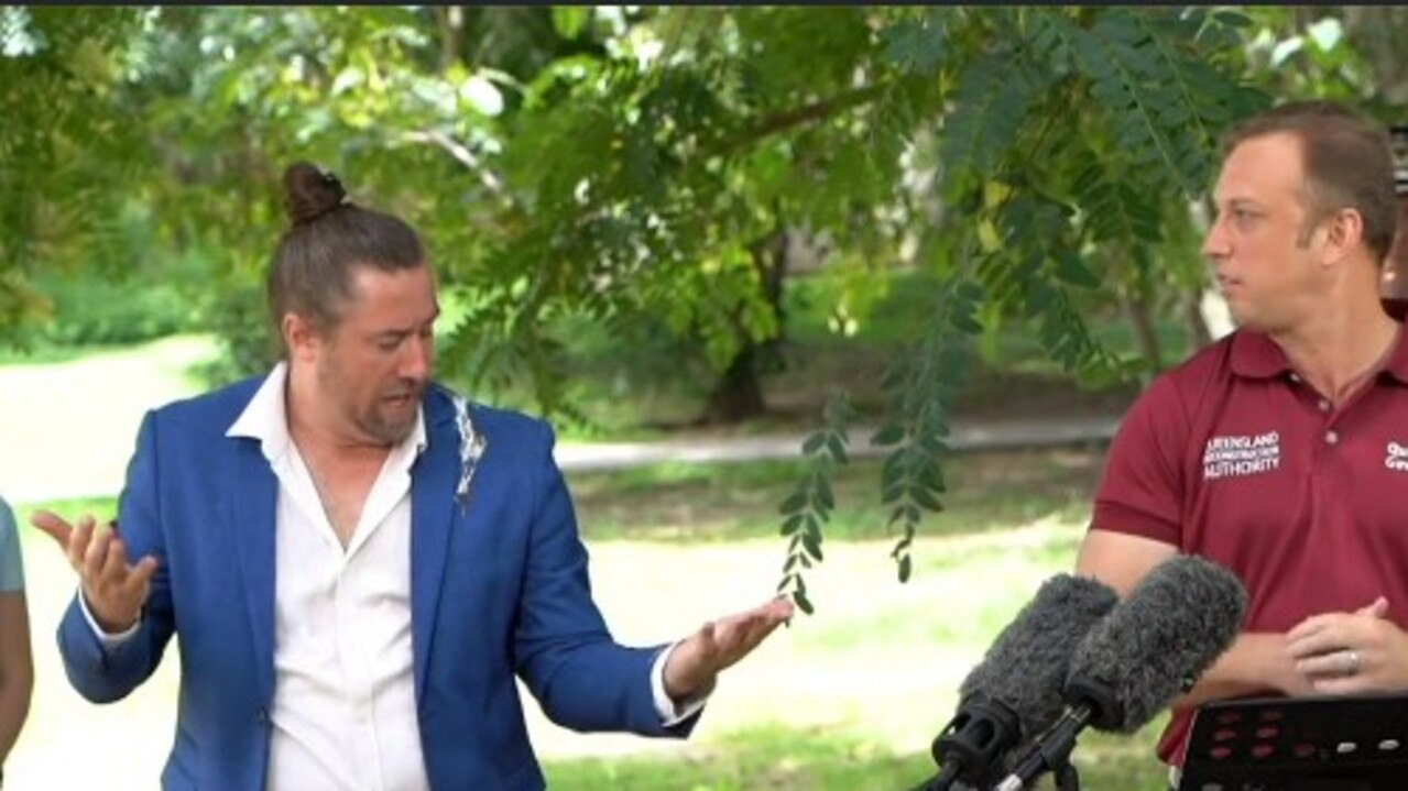 Much-loved Auslan interpreter Mikey Webb was the unfortunate target of a rogue bird at the Queensland government flood presser on Wednesday.