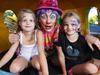 Cosmo (centre) the face painting clown with kids Lena Kirsten (right 9 years) and Laura Kirsten ( left 5 years) at Muddy's Playground for a preview to the Children's Festival