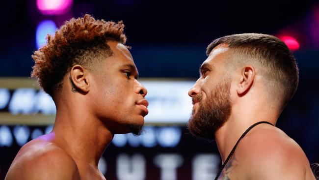 Devin Haney (L) faces off against Vasyl Lomachenko.