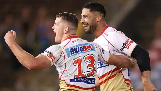 Dolphins Tom Gilbert and Jesse Bromwich celebrate after defeating Newcastle Knights in Newcastle on March 17. Picture: Cameron Spencer/Getty Images