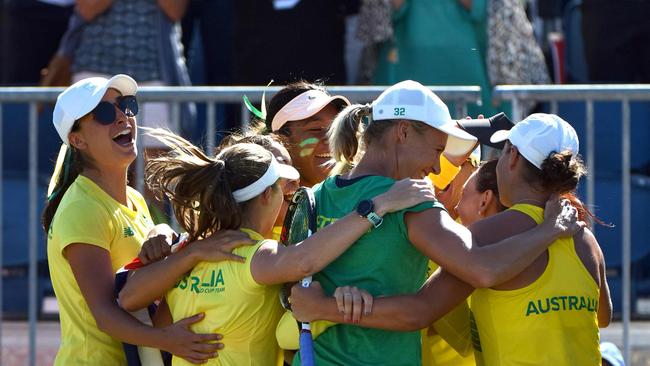 Australia's team members celebrate after beating Ukraine.