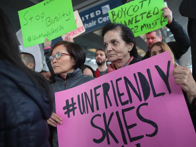 Demonstrators protest outside the United Airlines terminal at O'Hare International Airport after a passenger dragged from his seat and bloodied by airport police. Picture: Scott Olson/Getty Images/AFP