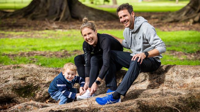 Jess Stenson with husband Dylan and son Billy, 3, getting ready for the City-Bay. Picture: Tom Huntley