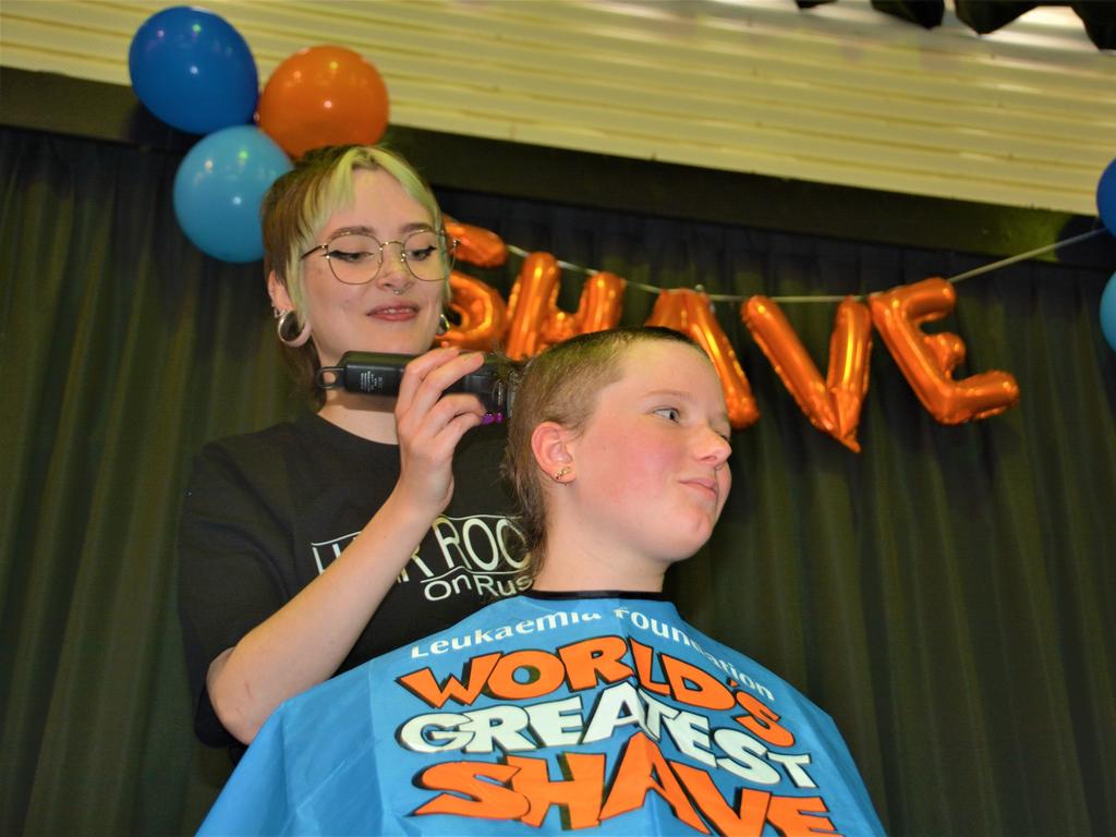 At the St Joseph's College 2023 World's Greatest Shave event is Meghan Ellis getting her cut by hairdresser Caitlin Symes from the Hair Room on Russell. Picture: Rhylea Millar