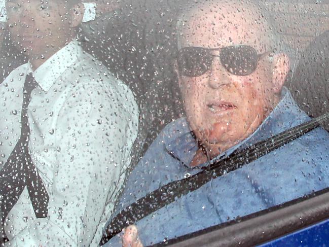 John Chardon is escorted from Coomera Police Station to Southport Police Station. Picture: Luke Marsden