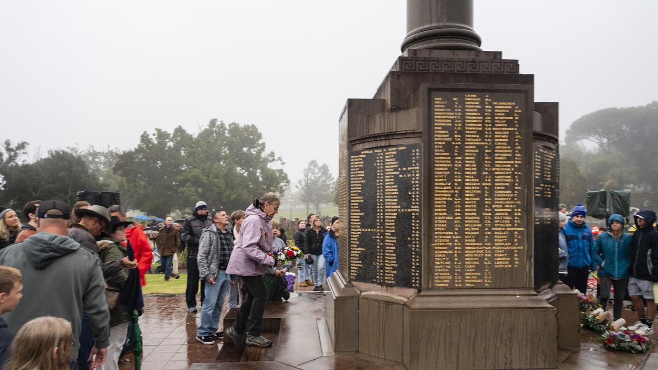 Cathy Fairleigh lays a wreath in honour of her late husband 20 year Army vet Garry Fairleigh at the conclusion of the Anzac Day Toowoomba Dawn Service at the Mothers' Memorial, Tuesday, April 25, 2023. Picture: Kevin Farmer