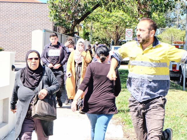 Worried parents rush to Banksia Rd Public School, Greenacre, following reports a car has crashed into a classroom. Picture: Eliza Barr