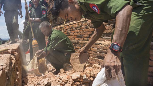 Using brooms and their hands, soldiers and residents of the ancient Myanmar city famous for its historic Buddhist pagodas began cleaning up the debris a powerful earthquake shook the region, killed at least four people, and damaged nearly 200 temples. Picture: Hkun Lat