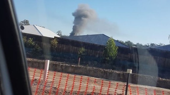 Smoke coming from the blaze at Brampton Court in Pimpama. Photo: Natallie Ward — Facebook